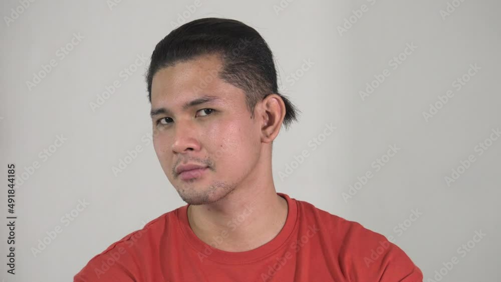 An Asian Man Winking Or Blinking An Asian Man Winking Or Blinking