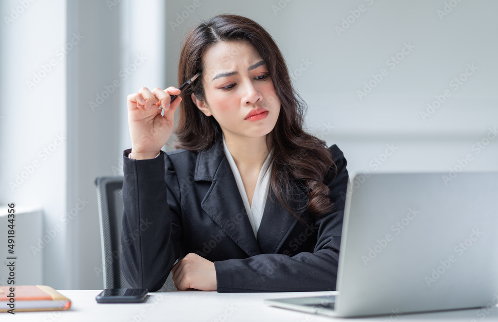 Young Asian businesswoman working at office Young Asian businesswoman working at office