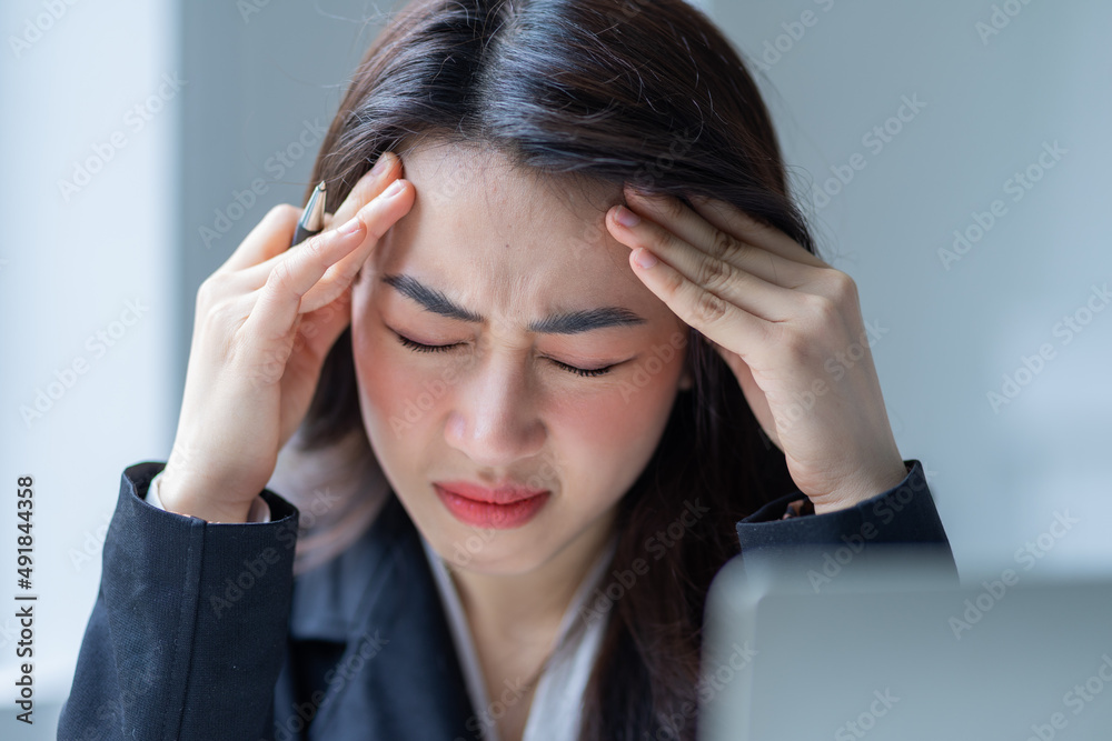 Young Asian businesswoman working at office Young Asian businesswoman working at office
