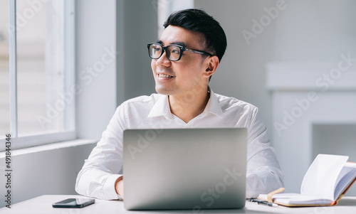 Young Asian businessman working at office