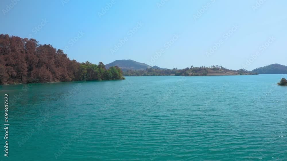 Green Canyon in Oymapinar Mount area at Manavgat. Wonderful view of the Taurus mountains and turquoise water. A burnt-out coniferous forest Green Canyon in Oymapinar Mount area at Manavgat. Wonderful view of the Taurus mountains and turquoise water. A burnt-out coniferous forest