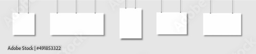 Template of white blank vector posters. Set of mockups hanging on the wall. Frame for paper sheet. Isolated on gray background. Vector illustration