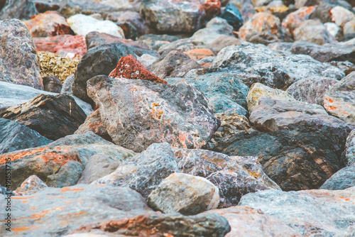 Selective focused on big colorful stone or rock at sea beach.