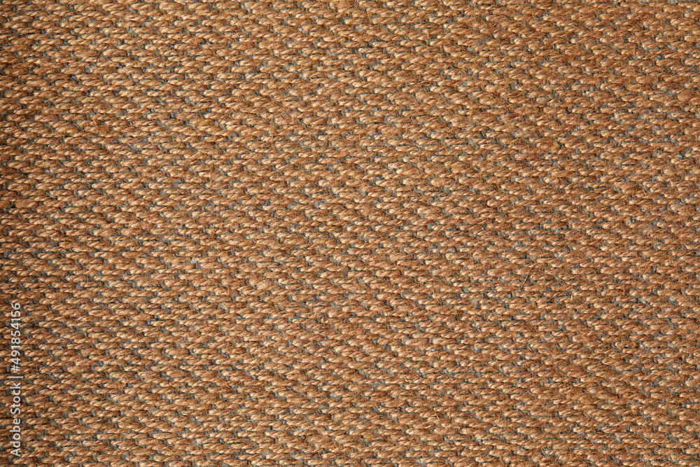 fabric in golden color with geometric patterns. mustard knitted texture, background knitted mustard color fabric in golden color with geometric patterns. mustard knitted texture, background knitted mustard color