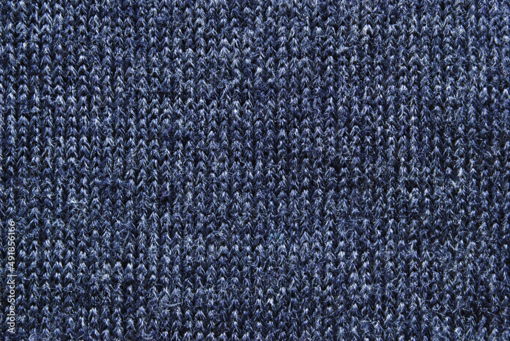 Fototapeta premium Gray soft knit fabric pattern close up as background
