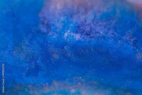 Paints blend. Abstract background design. Blue pink glitter inks mix