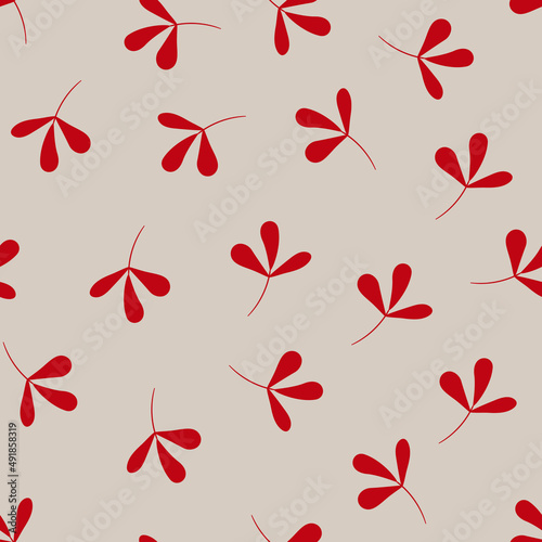 Seamless pattern with red twigs on a beige background.