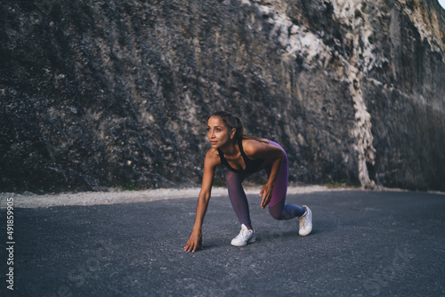 Pumped up jogger in sportswear ready for sprinting during morning cardio training - pursuit challenge, Caucasian female athlete feeling motivation for speed running - workout endurance concept