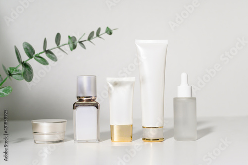 moisturizing cream bottle over leaf background studio, packing and skincare beauty concept photo
