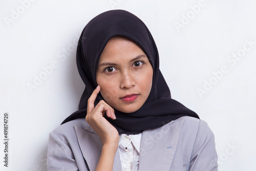 portrait of beautiful young asian muslim woman with clean and fresh skin isolated on white background 