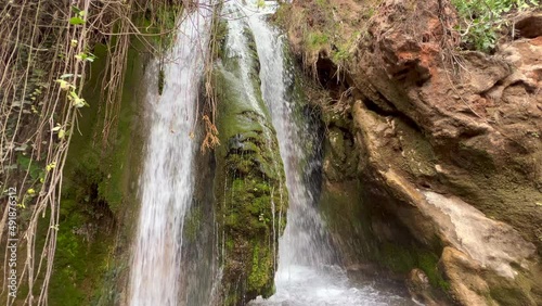 Close-up shot of a waterfall in the middle of a national park photo