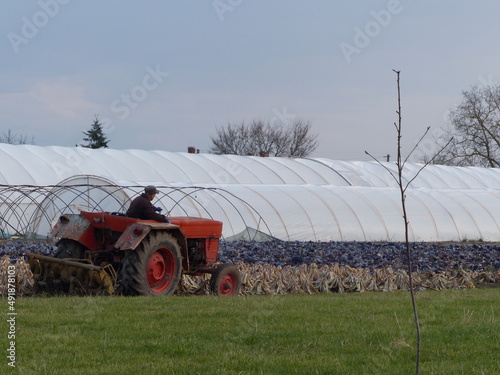 preparing the soil with the tractor for new sowing
