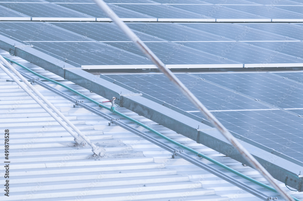 Lots of solar panels roof shape. Solar energy Change to electric power for use in buildings or factories. Technology for the future protect the environment. Lots of solar panels roof shape. Solar energy Change to electric power for use in buildings or factories. Technology for the future protect the environment.