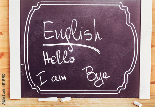 Learning English Language  Education Concept with Chalk Board and the phrase Hello, I am ,Bye  photo
