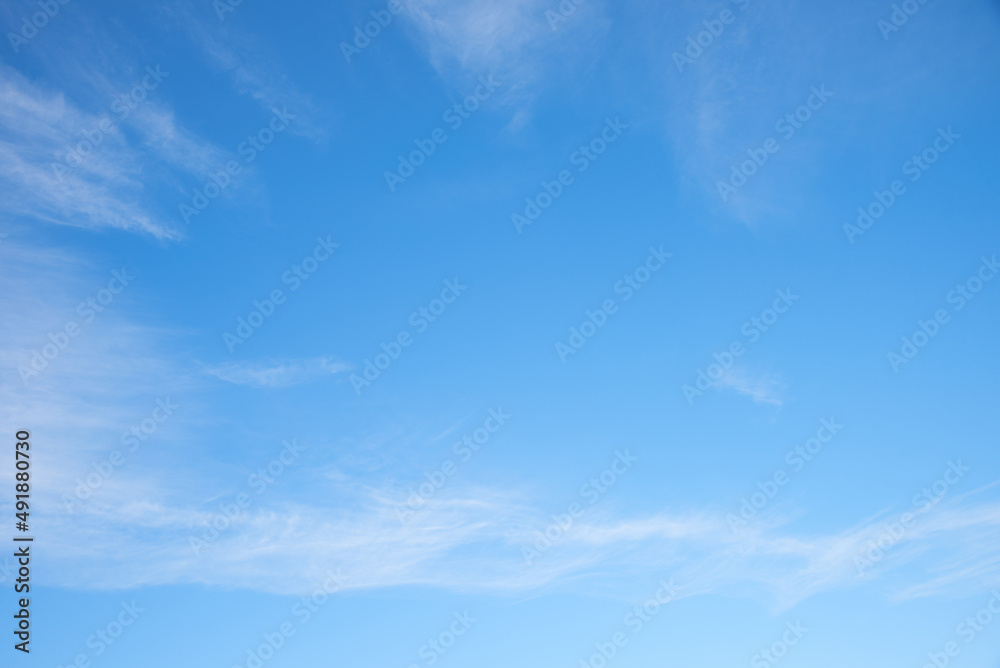 soft sky with fluffy cirrus clouds, blue space in the middle soft sky with fluffy cirrus clouds, blue space in the middle