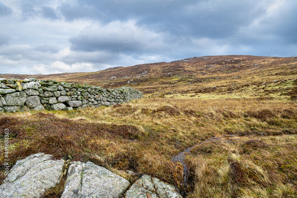 Drystone wall on the peatlands of the Isle of Lewis in the outer Hebrides, Scotland