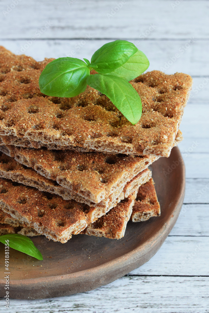Crackers with a high fiber content, buckwheat crackers in a clay plate