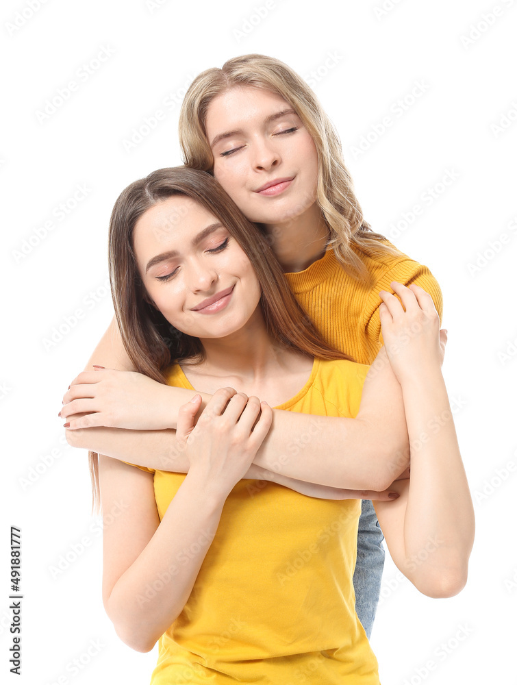 Portrait of young sisters isolated on white Portrait of young sisters isolated on white