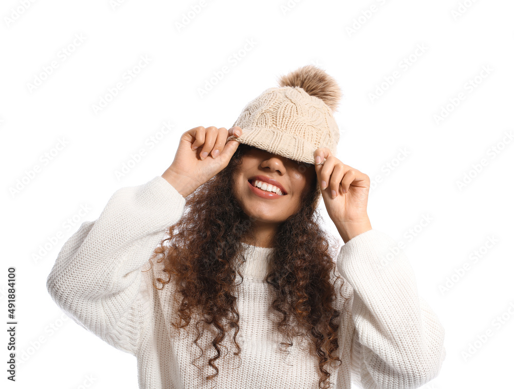 Funny African-American woman in warm clothes on white background Funny African-American woman in warm clothes on white background