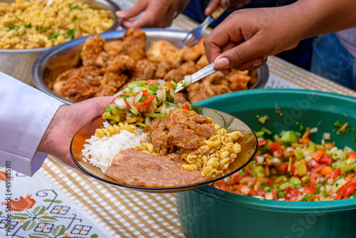 Simple and traditional Brazilian food being served in a popular restaurant for the local low-income population. photo