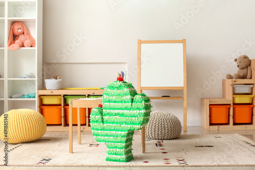 Green cactus pinata with co...