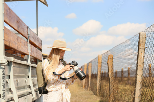 Beautiful female tourist wi...