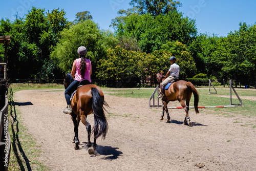 couple of riders practicing horseback riding together