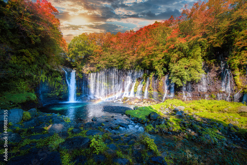 Shiraito Falls with colorful autumn leaf in Fujinomiya, Shizuoka, Japan. photo