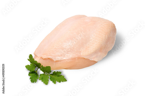 High quality photo of raw chiken breast with skin and a piece of parsley