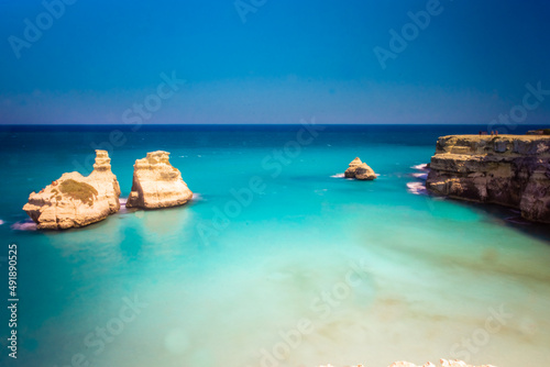 Landscape of the sea stacks "Due Sorelle" from the cliffs of Salento, Apulia Italy