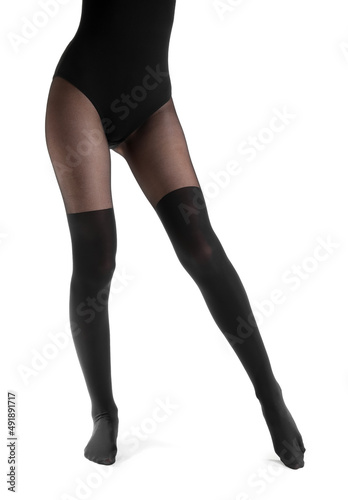 Beautiful young woman in black tights isolated on white