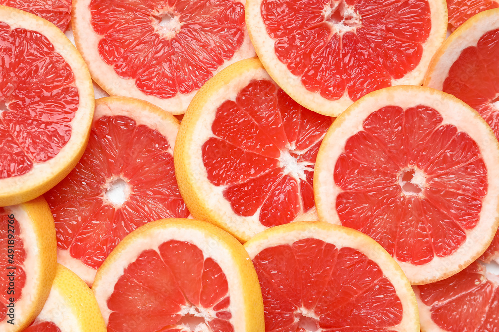 Slices of tasty ripe grapefruit as background Slices of tasty ripe grapefruit as background
