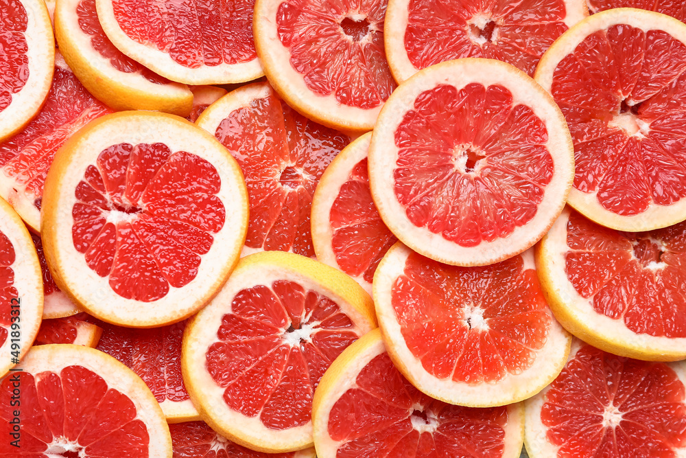 Slices of fresh grapefruit as background Slices of fresh grapefruit as background