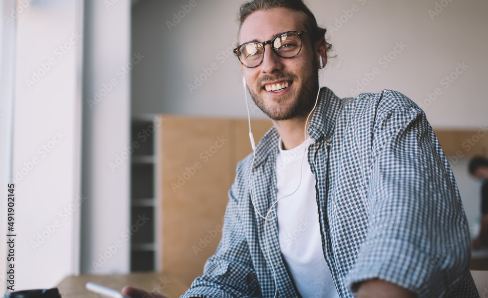 Caucasian businessman work at windowsill in office Caucasian businessman work at windowsill in office