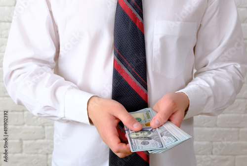 Wallpaper Mural Businessman counting money. US dollars banknotes Torontodigital.ca