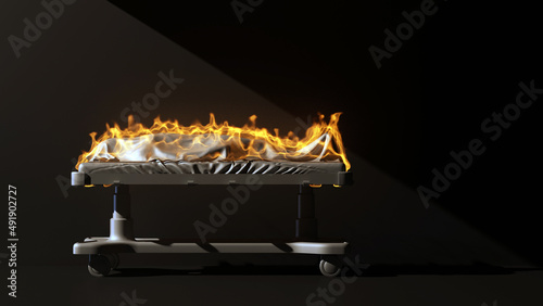 Bild auf Leinwand burning corpse in a gurney on a black background