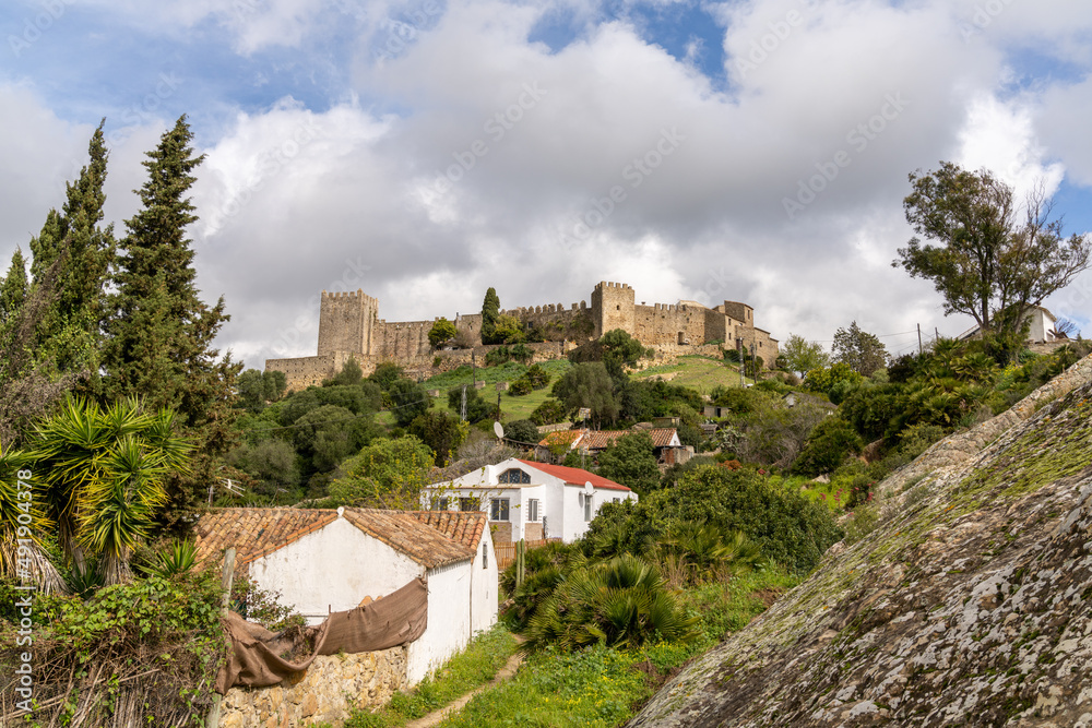 view of the castle of Castellar de la Frontera and village houses in the foreground