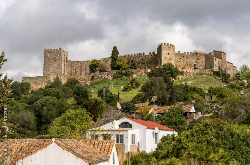 view of the castle of Castellar de la Frontera and village houses in the foreground