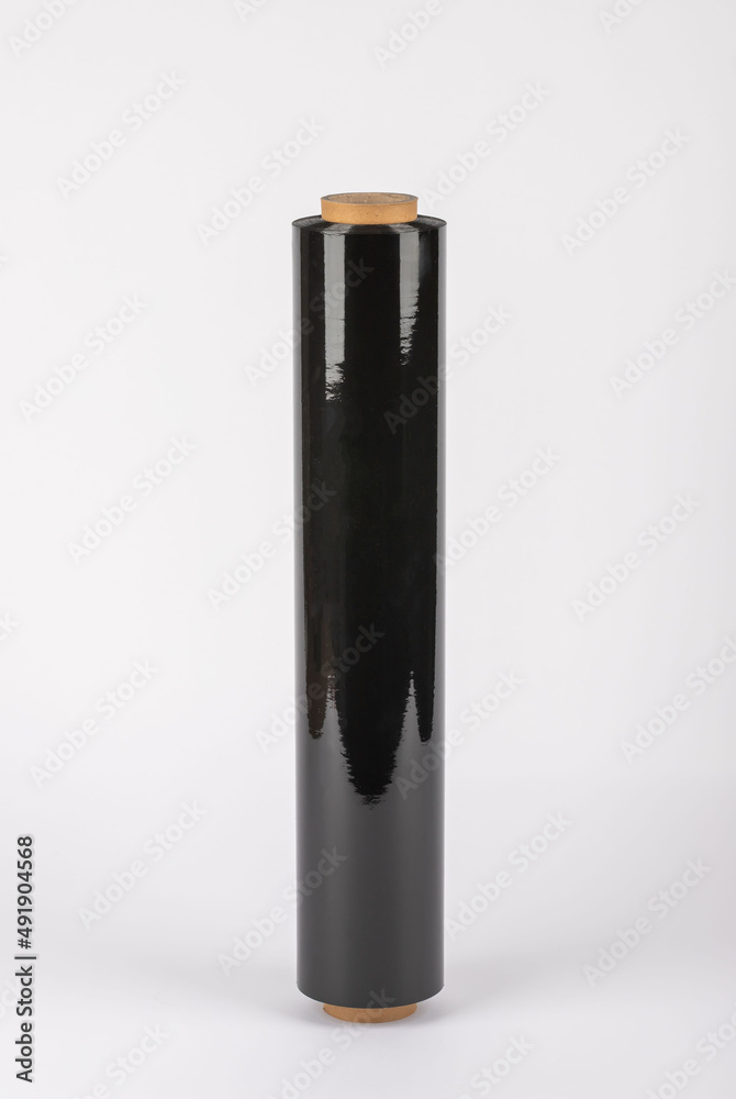 Roll of plastic cling film with black wrap. how long the roll of cling film can stretch is shown. It stands in an isolated environment. It is used in the packaging of products.