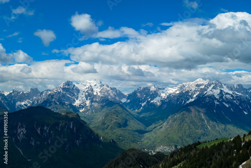 Panoramic view in spring from Frauenkogel on mount Mangart in the Julian Alps, Friuli, Italy. Border Austria, Italy, Slovenia. Triglav National Park. Upper Drava valley. Summit