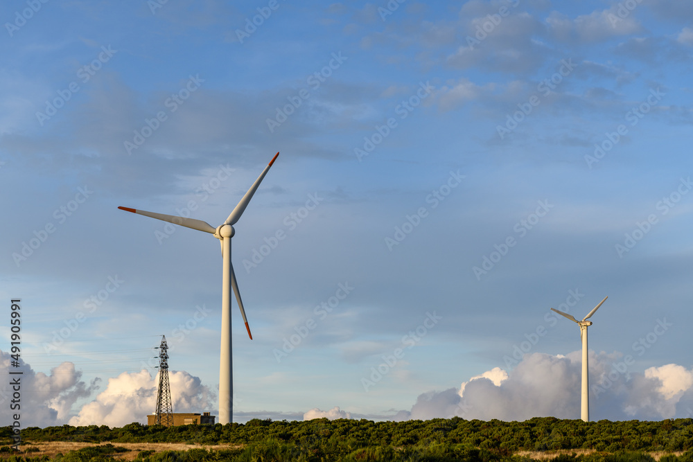 Wind turbines in mountains at sunset Wind turbines in mountains at sunset