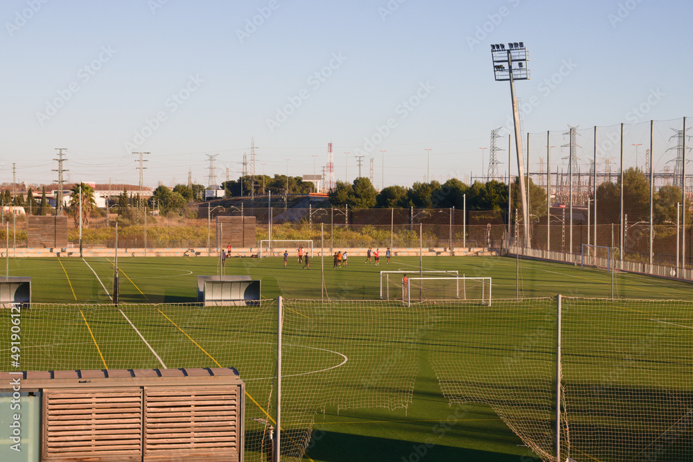 Fototapeta premium Panoramic view of a soccer field where young people carry out weekly training