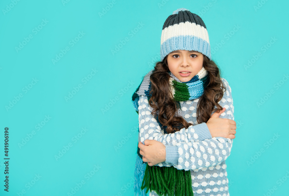portrait of child wearing warm clothes. express emotion. winter fashion. feeling cold.