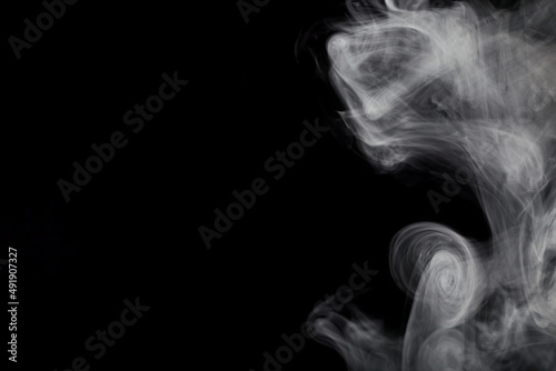 Fototapeta Naklejka Na Ścianę i Meble -  smoke on a black background, there is a place to record