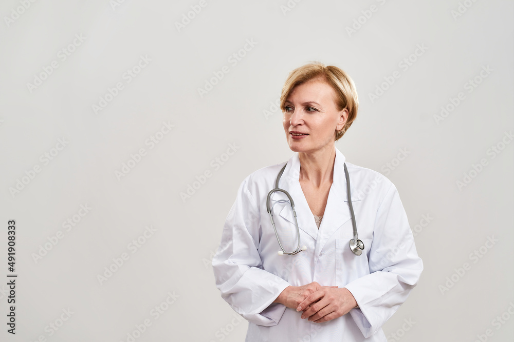 Partial image of focused female doctor look away Partial image of focused female doctor look away