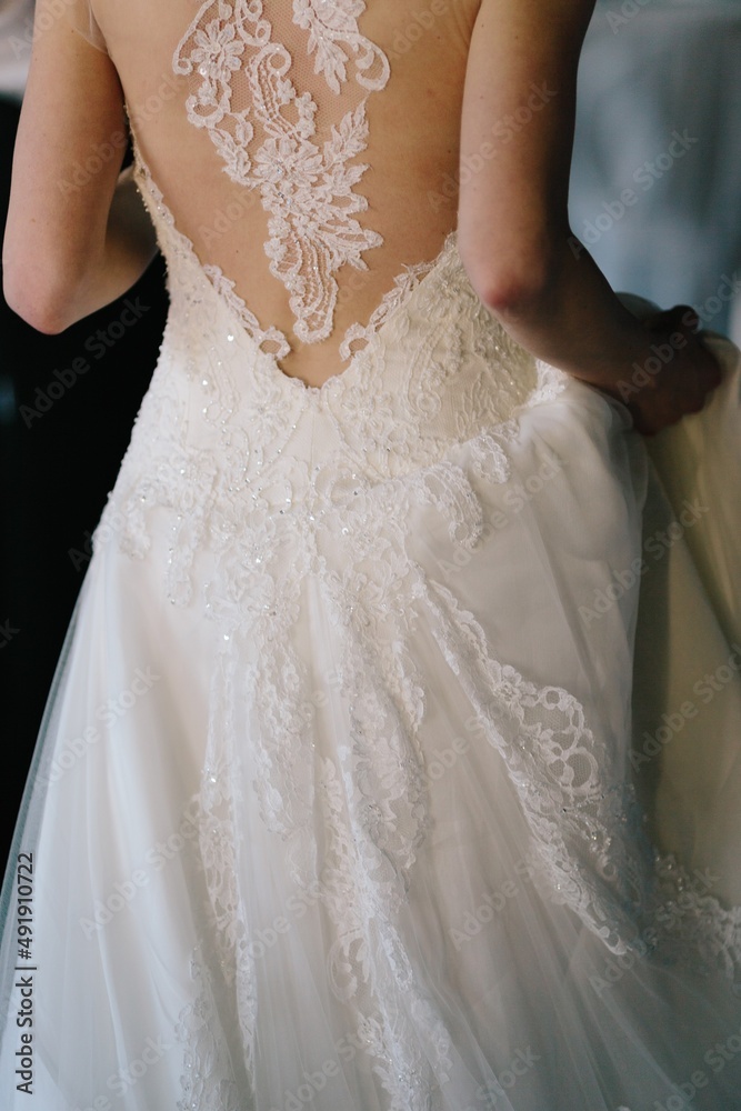 Cose-up of a bride's back and her wedding dress