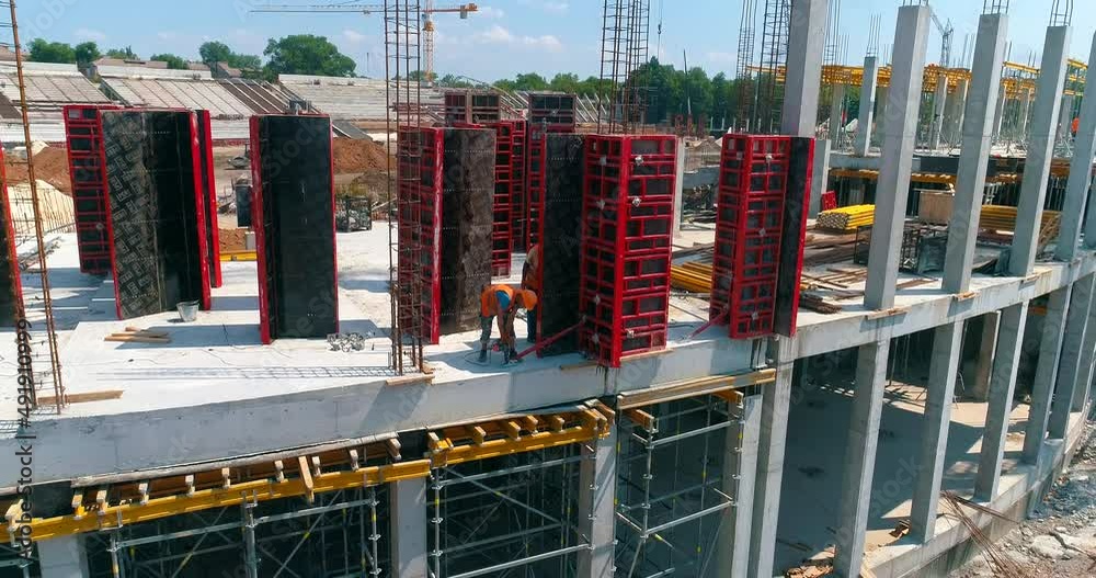 Construction process of a modern football stadium. Builders make