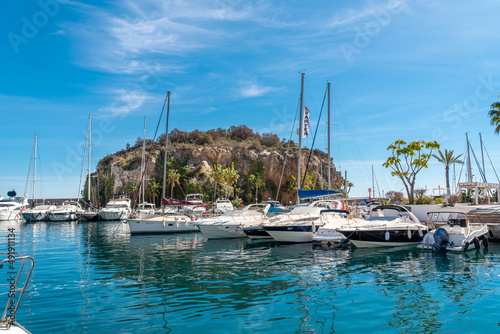 View of beautiful harbour "La Herradura". Beautiful bay area situated in Granada province. Luxury yachts docked. Sunny winter day. Luxury real estate.