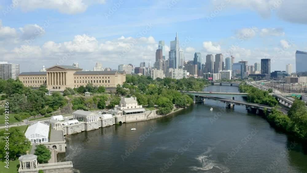 Beautiful Shot of the Philadelphia Skyline with the Art Museum and the Schuylkill River in the Foreground, Backwards Drone Movement Beautiful Shot of the Philadelphia Skyline with the Art Museum and the Schuylkill River in the Foreground, Backwards Drone Movement