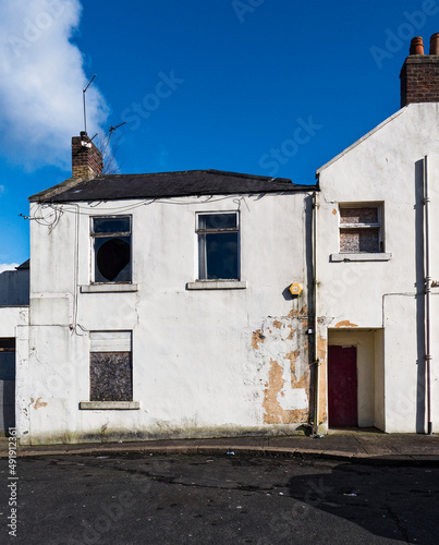 Disused and boarded up building, UK